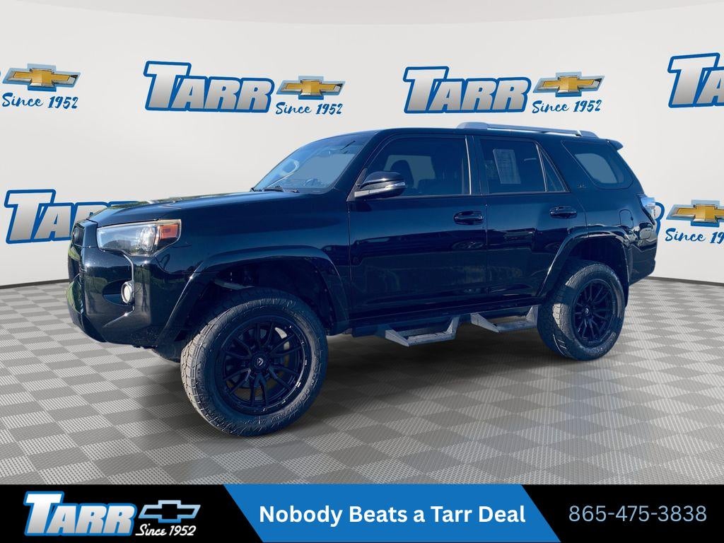 2017 Toyota 4Runner SR5 in Midnight Black — front three-quarter view